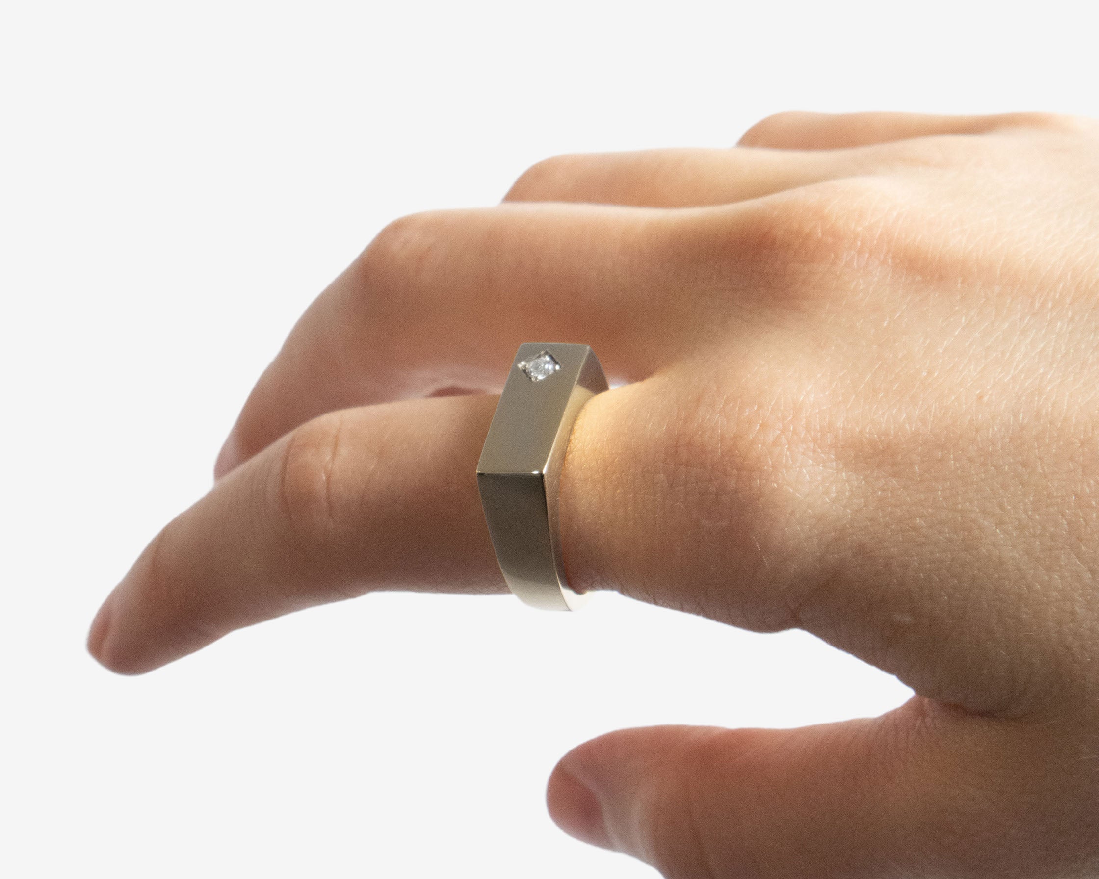 Close-up of Sener Besim diamond ring gold band