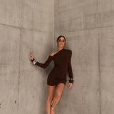 Woman in a brown dress standing by sener besim