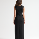 model in sener besim column long dress with split up back