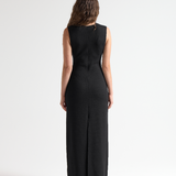 model in sener besim column long dress with split up back