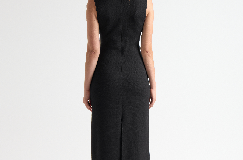 model in sener besim column long dress with split up back