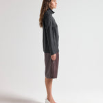 Model wearing relaxed fit blouse with high neck by sener besim