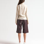 sener besim high neck relaxed top in cream worn by model 