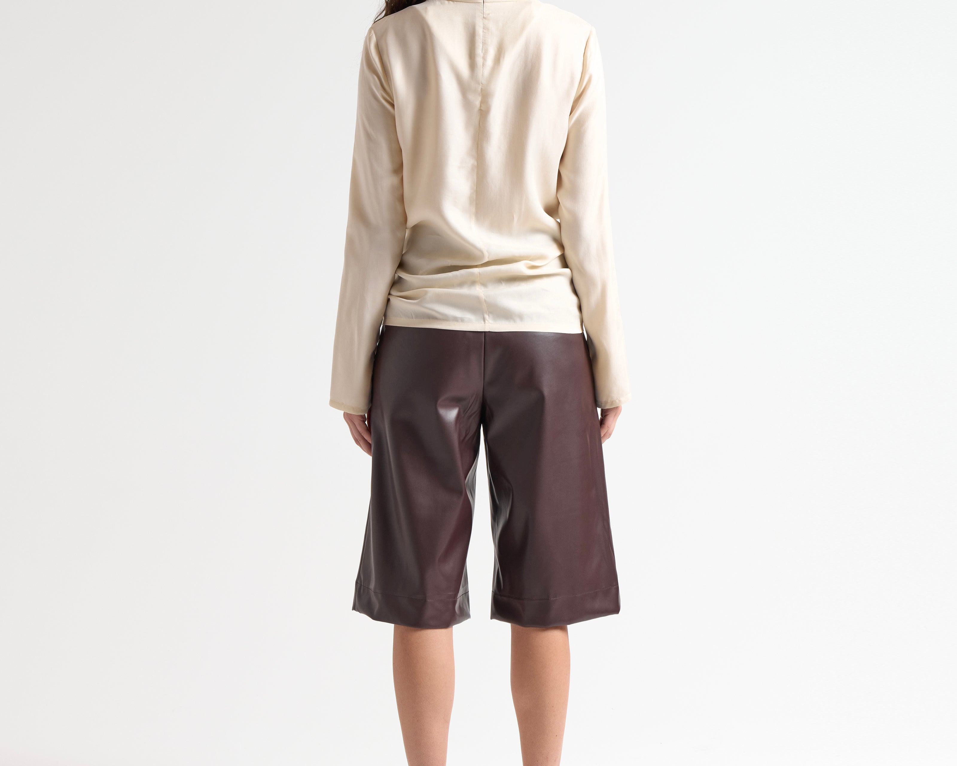 sener besim high neck relaxed top in cream worn by model 