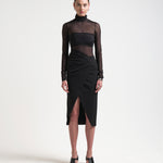 model in asymmetric skirt with ruching by sener besim