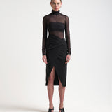 model in asymmetric skirt with ruching by sener besim