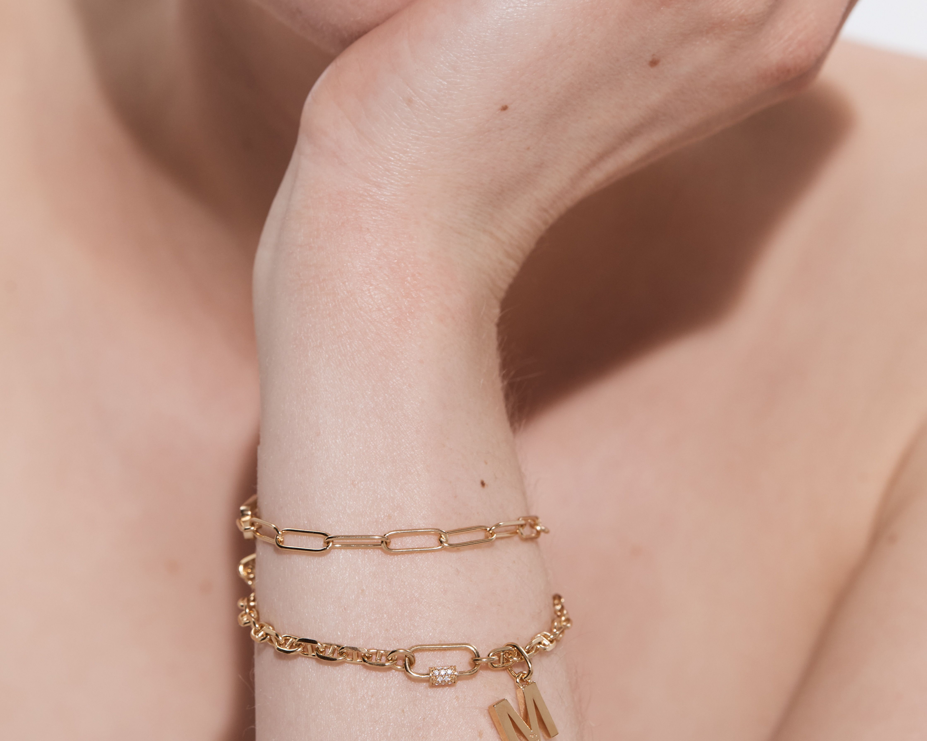 Oval Carabiner with Gems styled on a layered bracelet — Sener Besim buildable jewellery