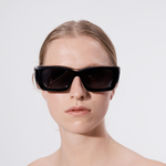 Şener Besim Acetate 2 black and clear sunglasses worn, chunky rectangular acetate frame, front view
