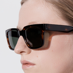Şener Besim Acetate 3 tortoise sunglasses worn, thick square acetate frame, close up