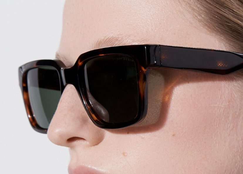 Şener Besim Acetate 3 tortoise sunglasses worn, thick square acetate frame, close up