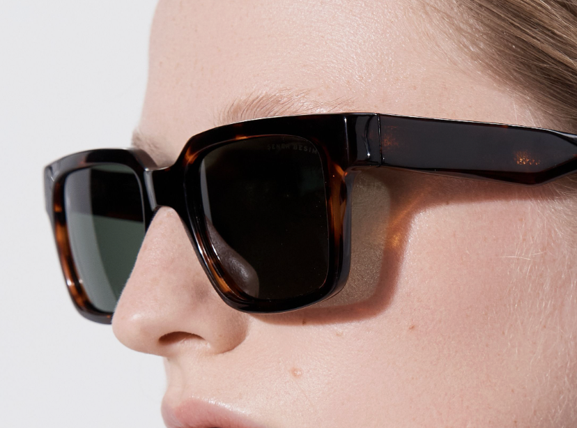 Şener Besim Acetate 3 tortoise sunglasses worn, thick square acetate frame, close up
