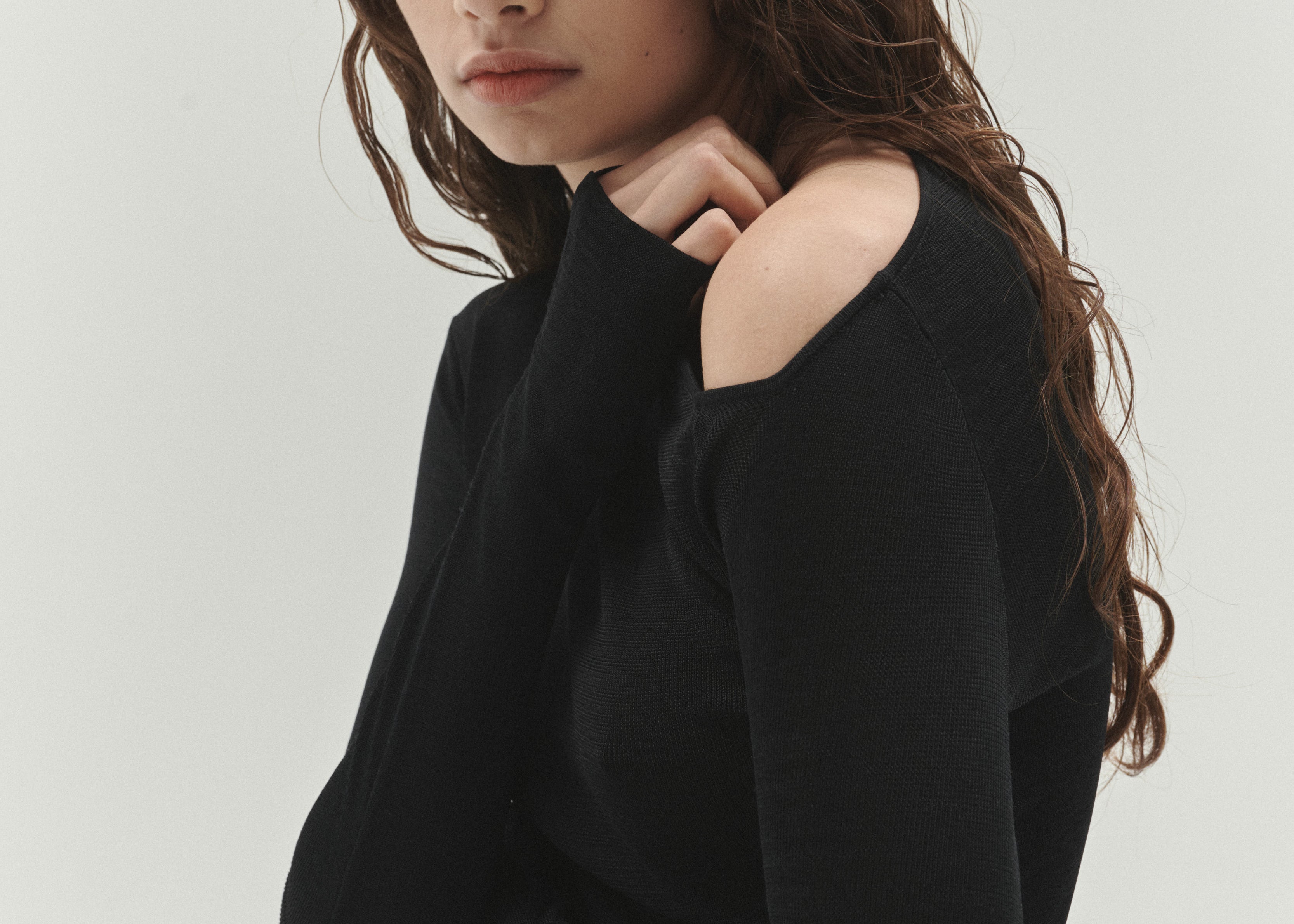 Şener Besim Angular Neck Top in Black, close-up of the angular neckline detail