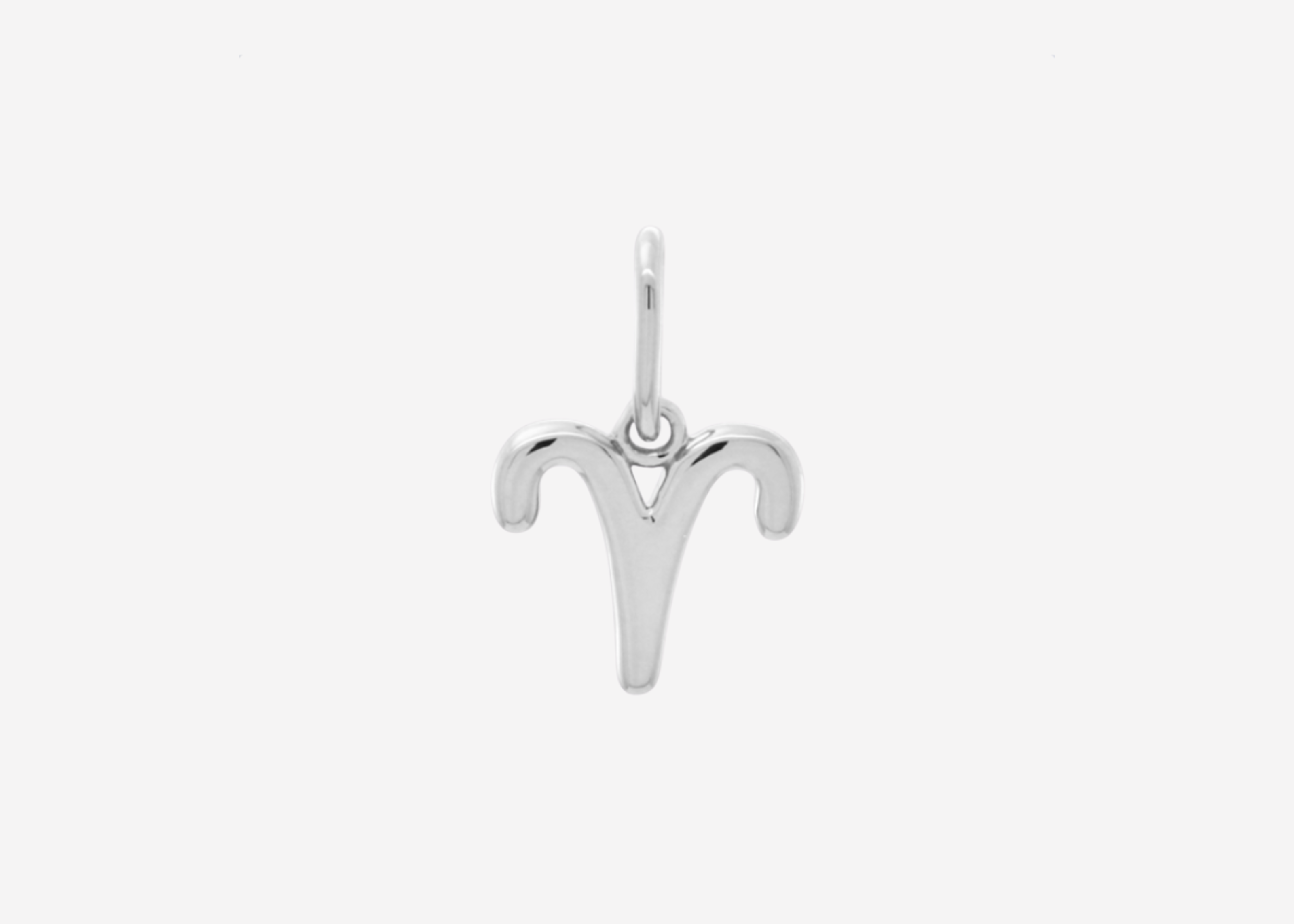 Şener Besim Aries Charm in silver rhodium plating, flat lay