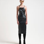 bared back leather apron style leather dress on model by sener besim