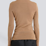merino knit on model in bronwn with thumbhole detail by sener besim