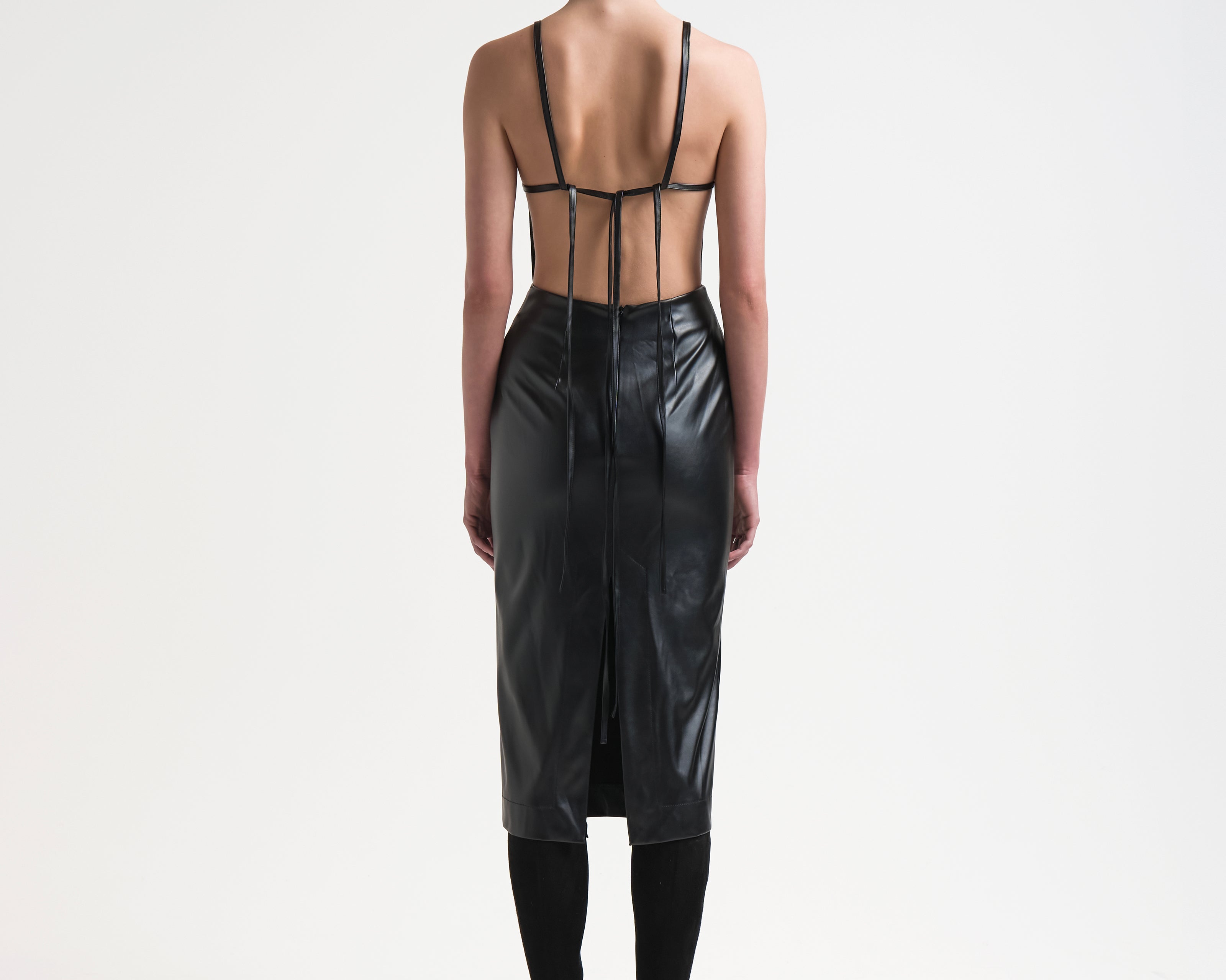 open back dress on model with ties in vegan leather by sener besim