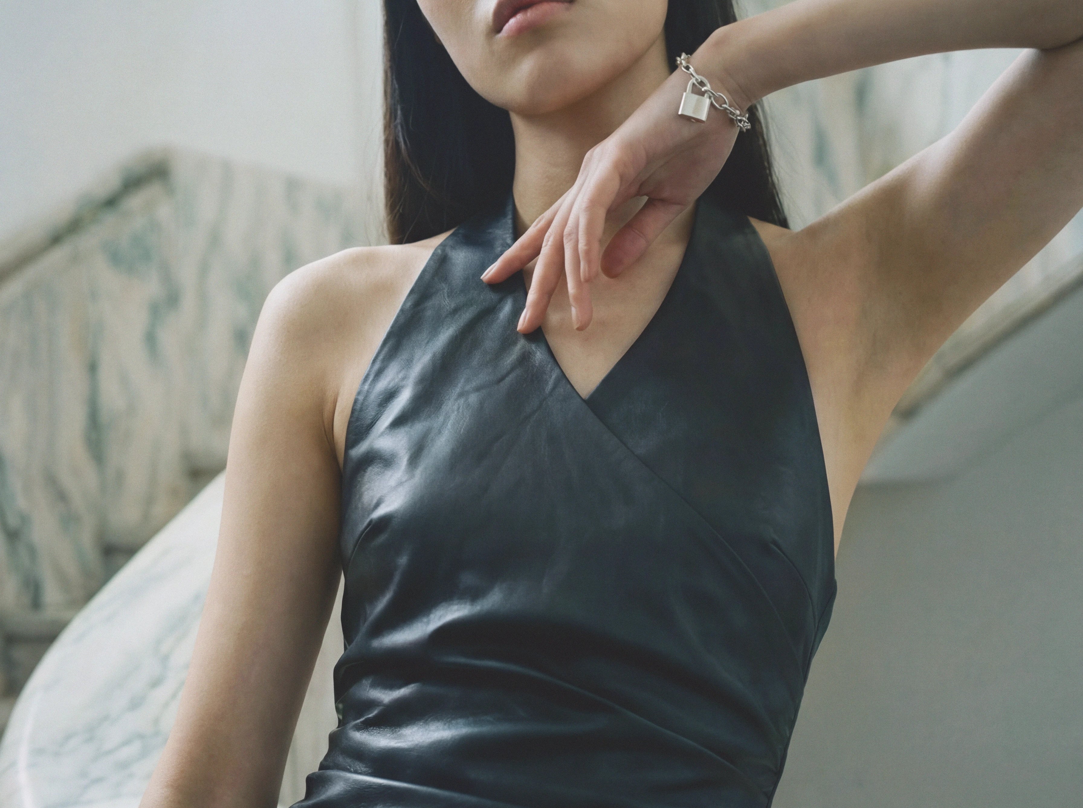Vegan leather halter neck mini dress with ruching close up — Şener Besim
