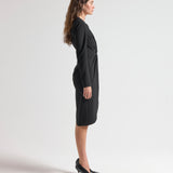 side view model wearing sener besim long sleeve mid length dress