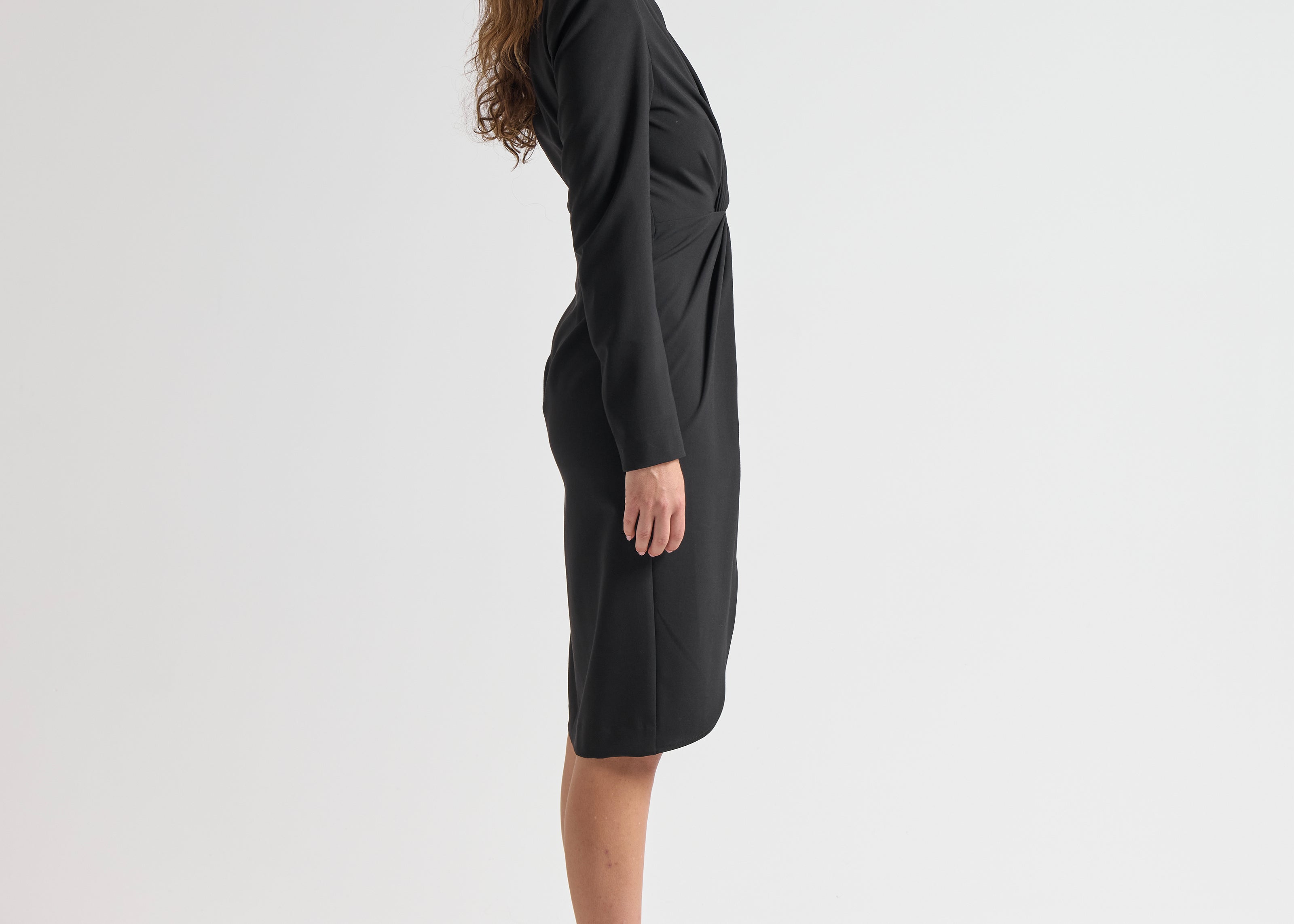 side view model wearing sener besim long sleeve mid length dress