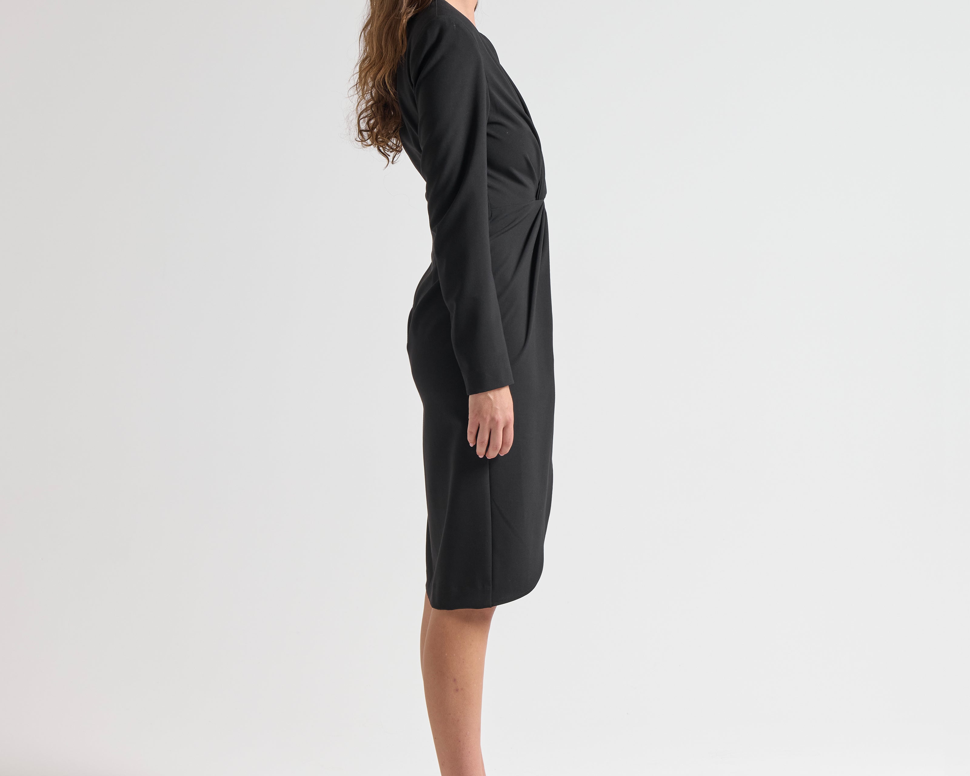 side view model wearing sener besim long sleeve mid length dress