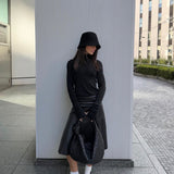 Thumbhole turtleneck in black worn on model — Şener Besim
