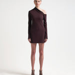 sener besim asymmetric mini dress with long sleeves worn by model 