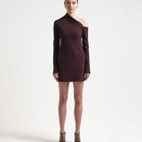sener besim asymmetric mini dress with long sleeves worn by model 