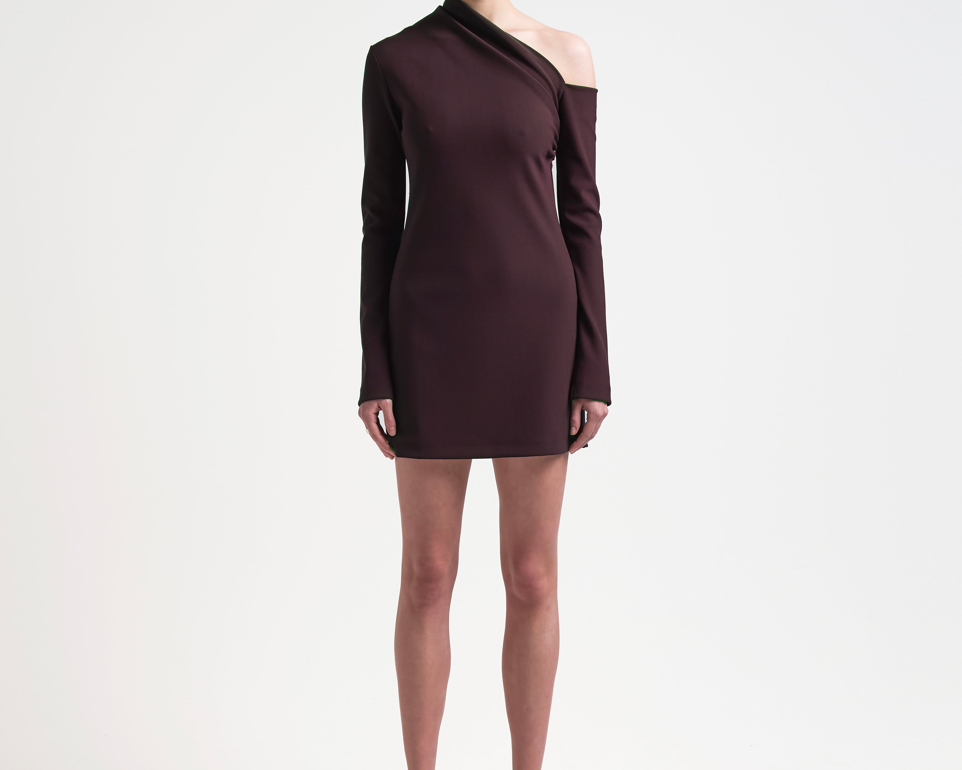 sener besim asymmetric mini dress with long sleeves worn by model 