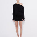Bonded mini dress on model with long tie cuff sleeves — Şener Besim