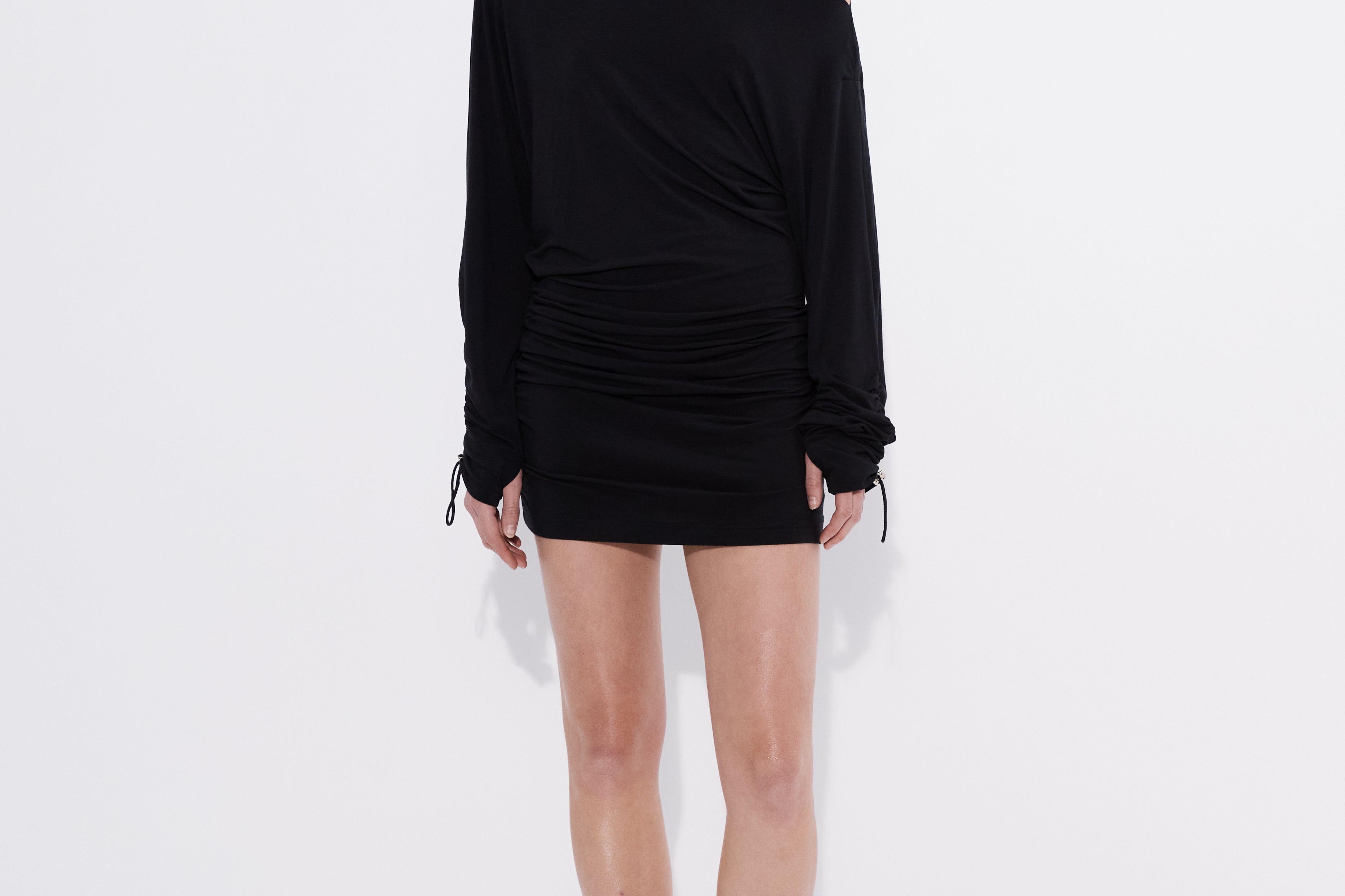 Bonded mini dress on model with long tie cuff sleeves — Şener Besim