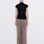 Merino cap sleeve turtleneck top black, model front view — Şener Besim