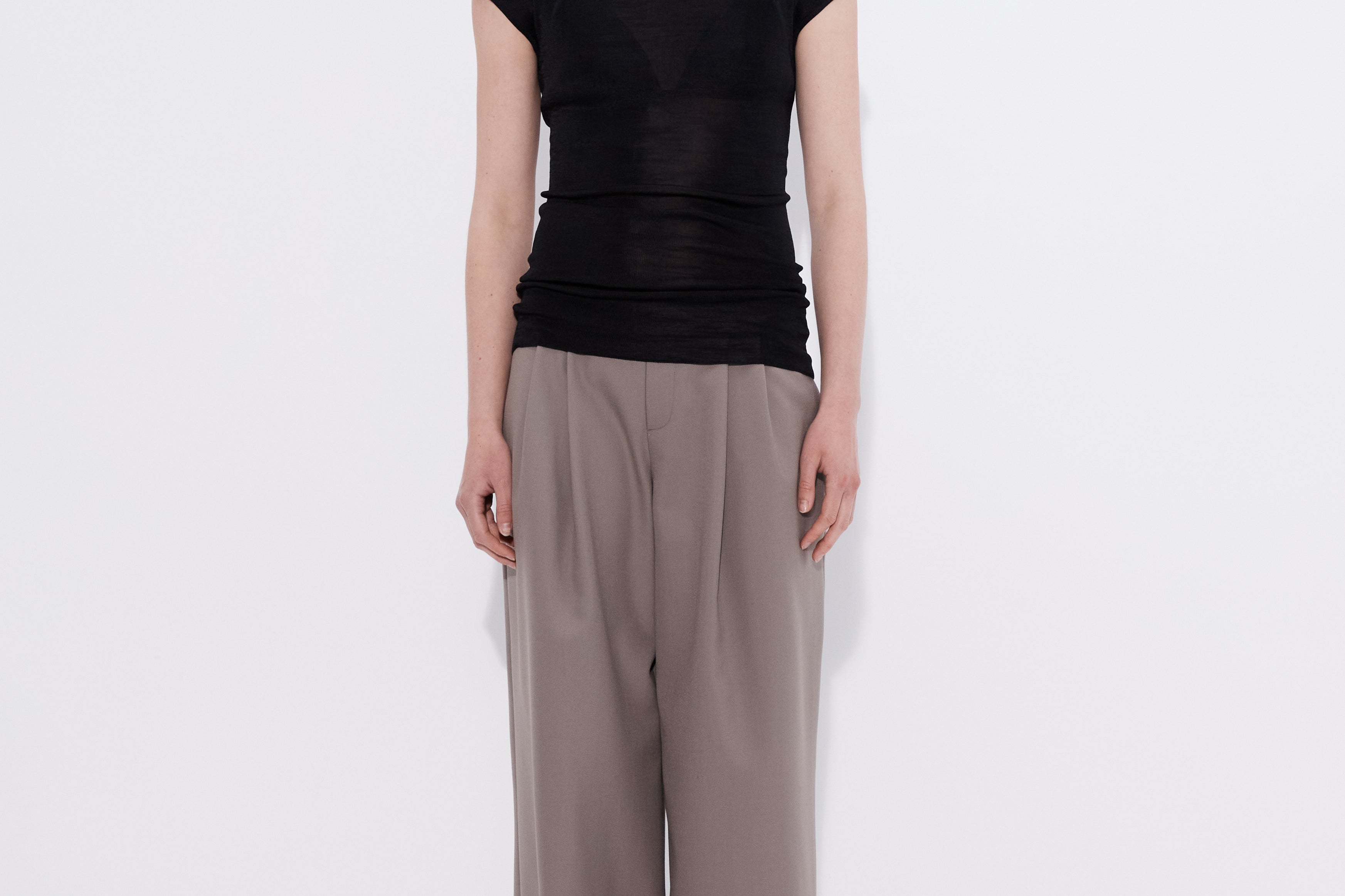 Merino cap sleeve turtleneck top black, model front view — Şener Besim