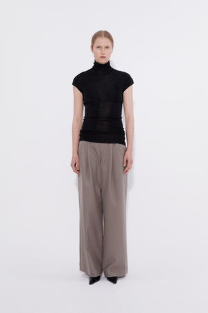 Merino cap sleeve turtleneck top black, model front view — Şener Besim