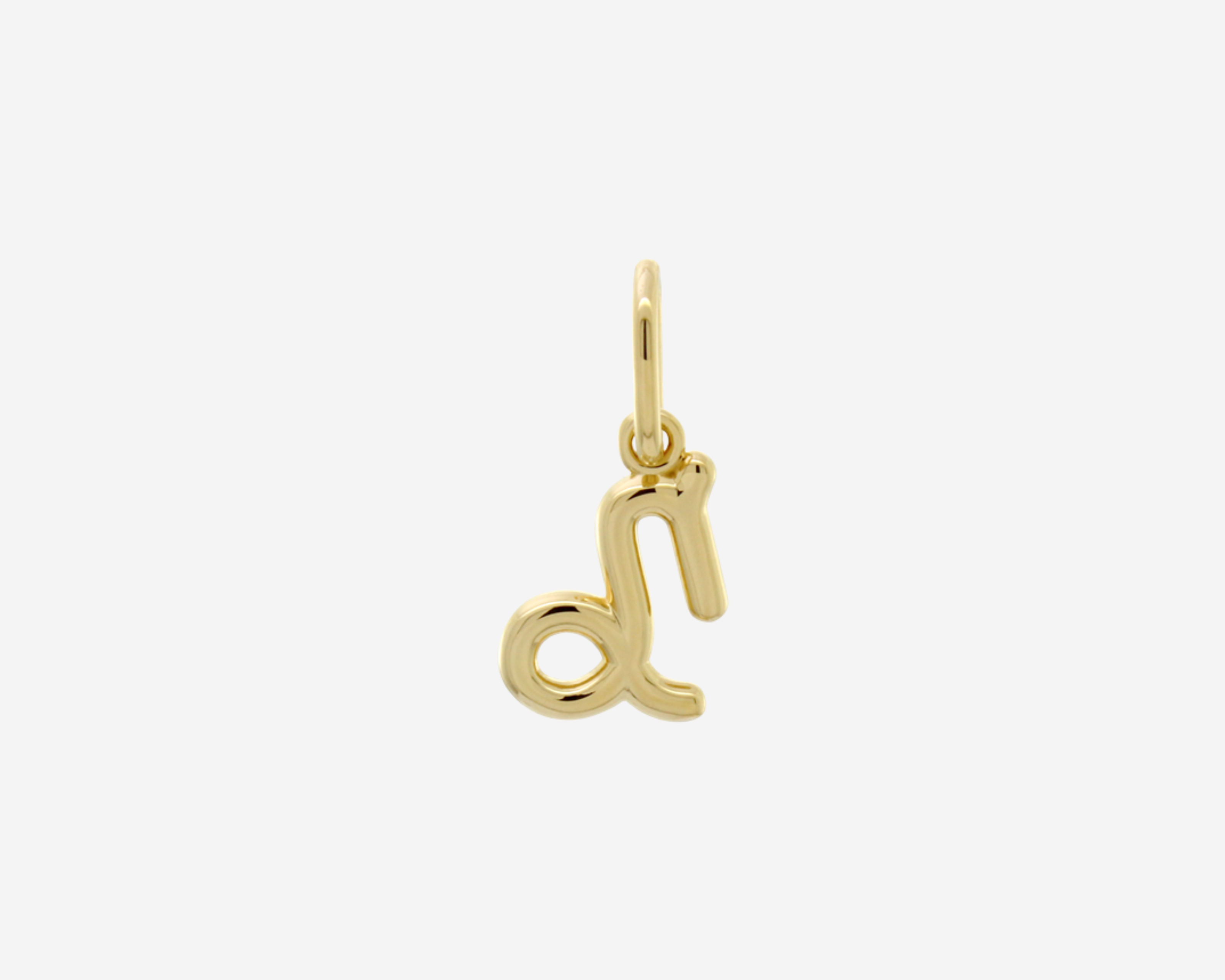 Şener Besim Capricorn Charm in 14ct gold plating, flat lay