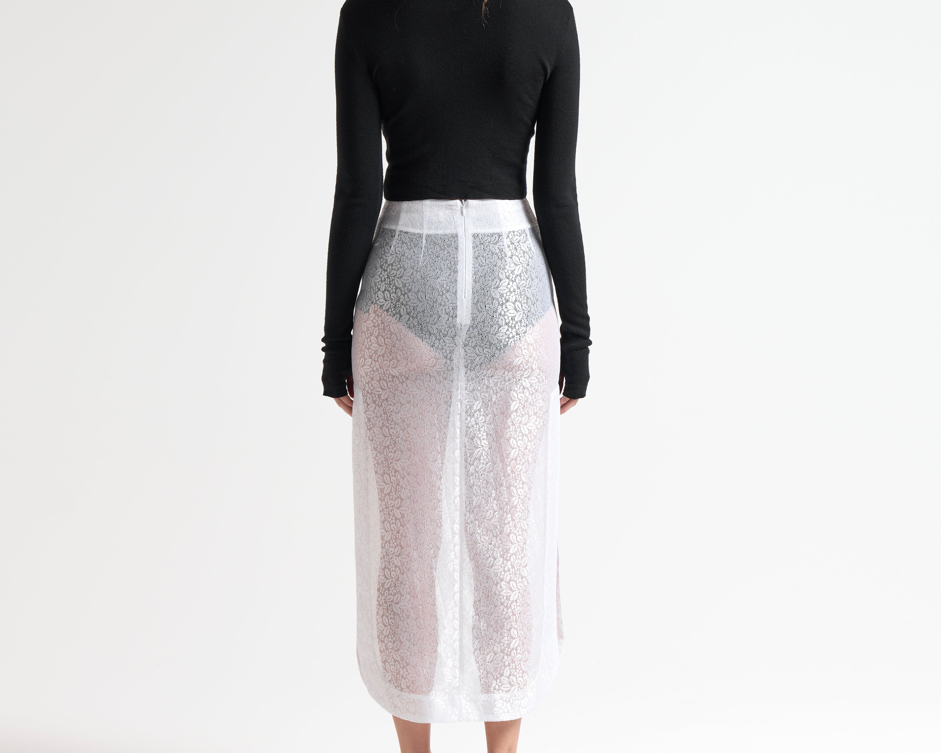Merino wool cropped cardi in black, styled with sheer midi skirt, front view — Şener Besim