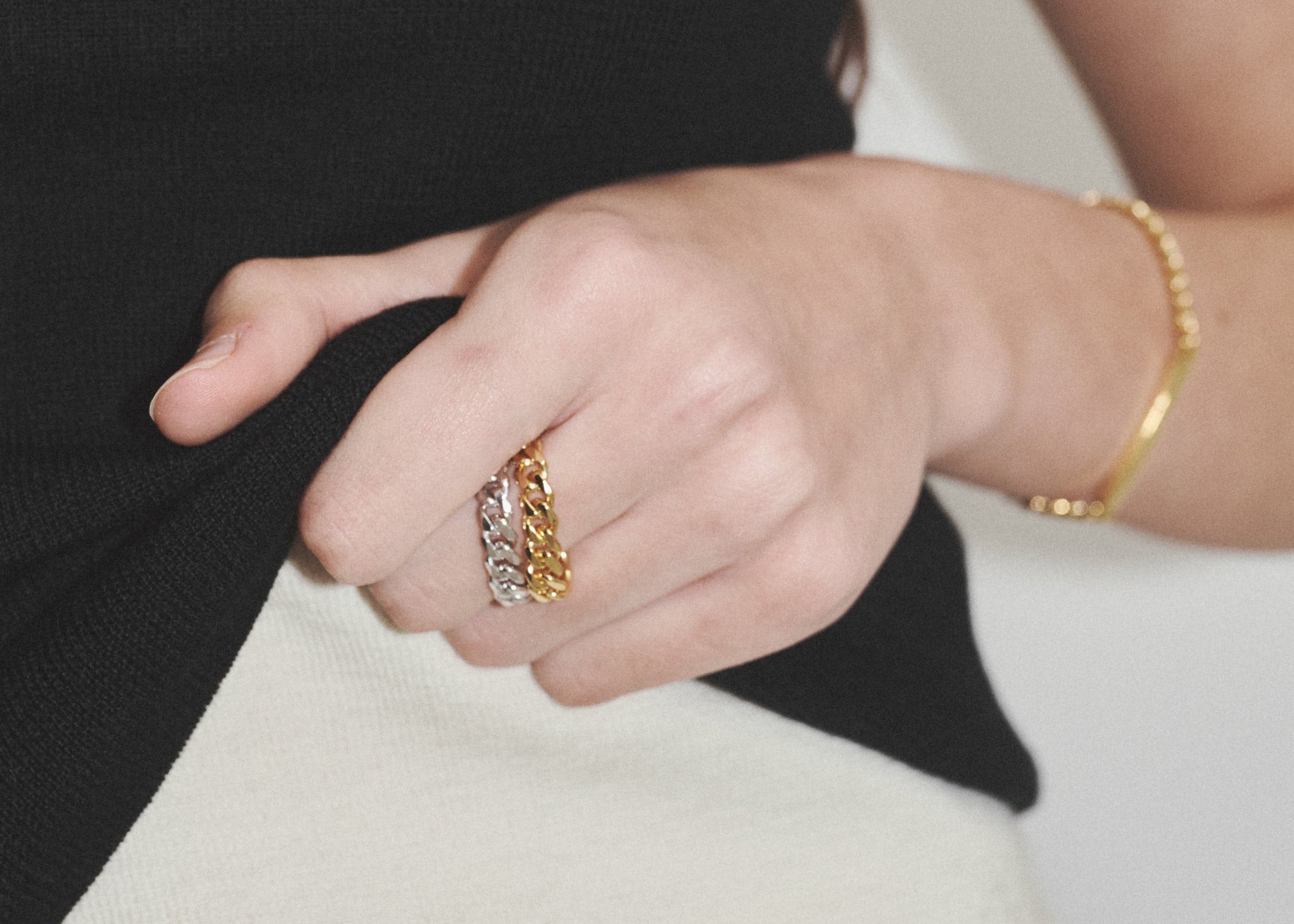 Şener Besim Cuban Chain Ring in Silver stacked with Gold ring on model