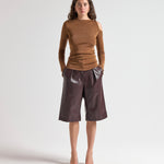 Şener Besim Cutout Crewneck in Spice, fine knit with cut-out shoulder detail, front view
