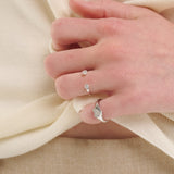 Şener Besim Double Diamond Ring in silver rhodium plating, stacked on model hand