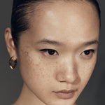 Blue grey enamel thick accent hoop earrings worn on ear — Şener Besim