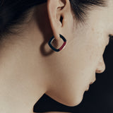 Burgundy enamel thick accent hoop earrings worn on ear — Şener Besim