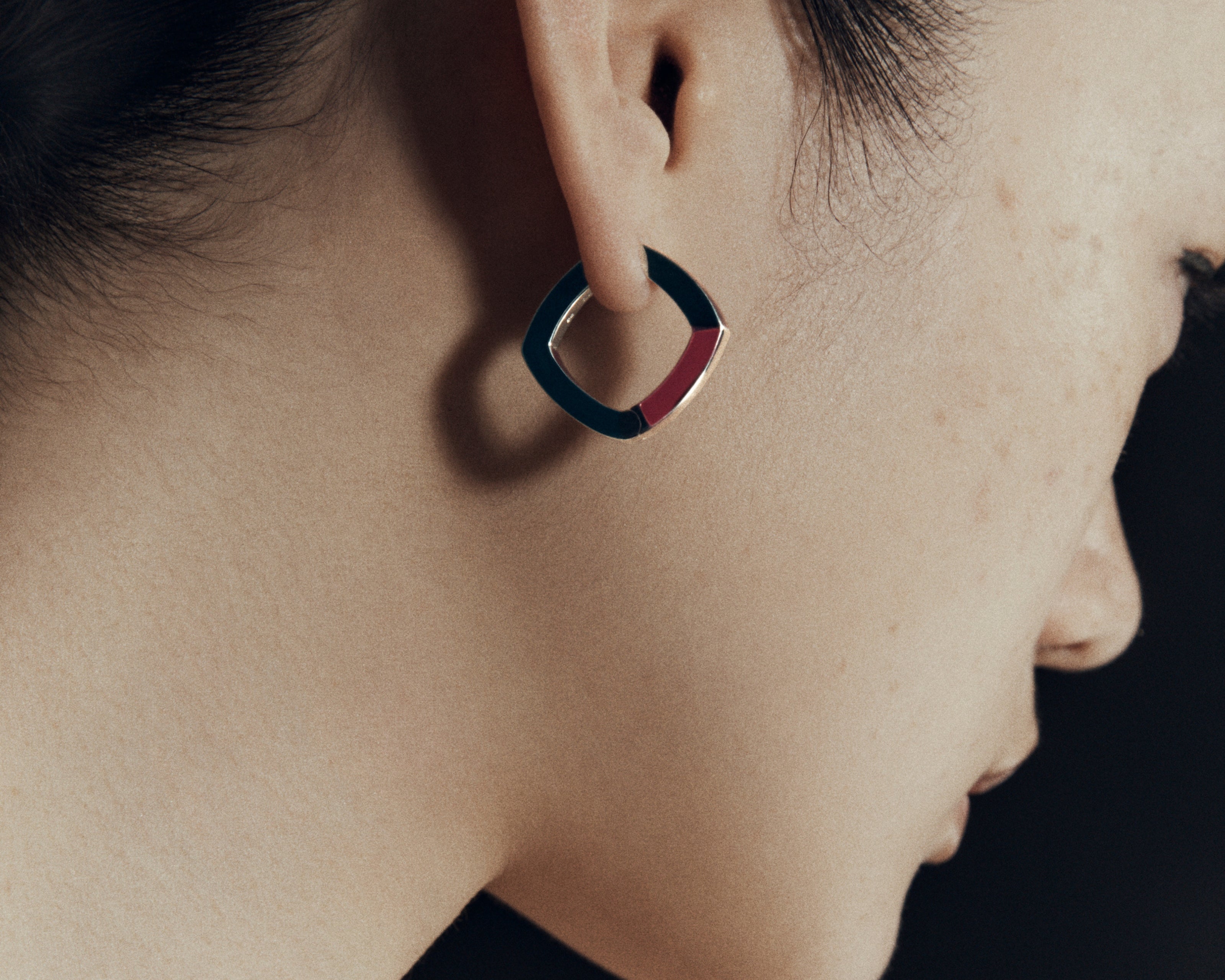 Burgundy enamel thick accent hoop earrings worn on ear — Şener Besim