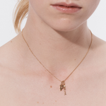 Alt: Şener Besim Fish Charm worn on necklace — sterling silver