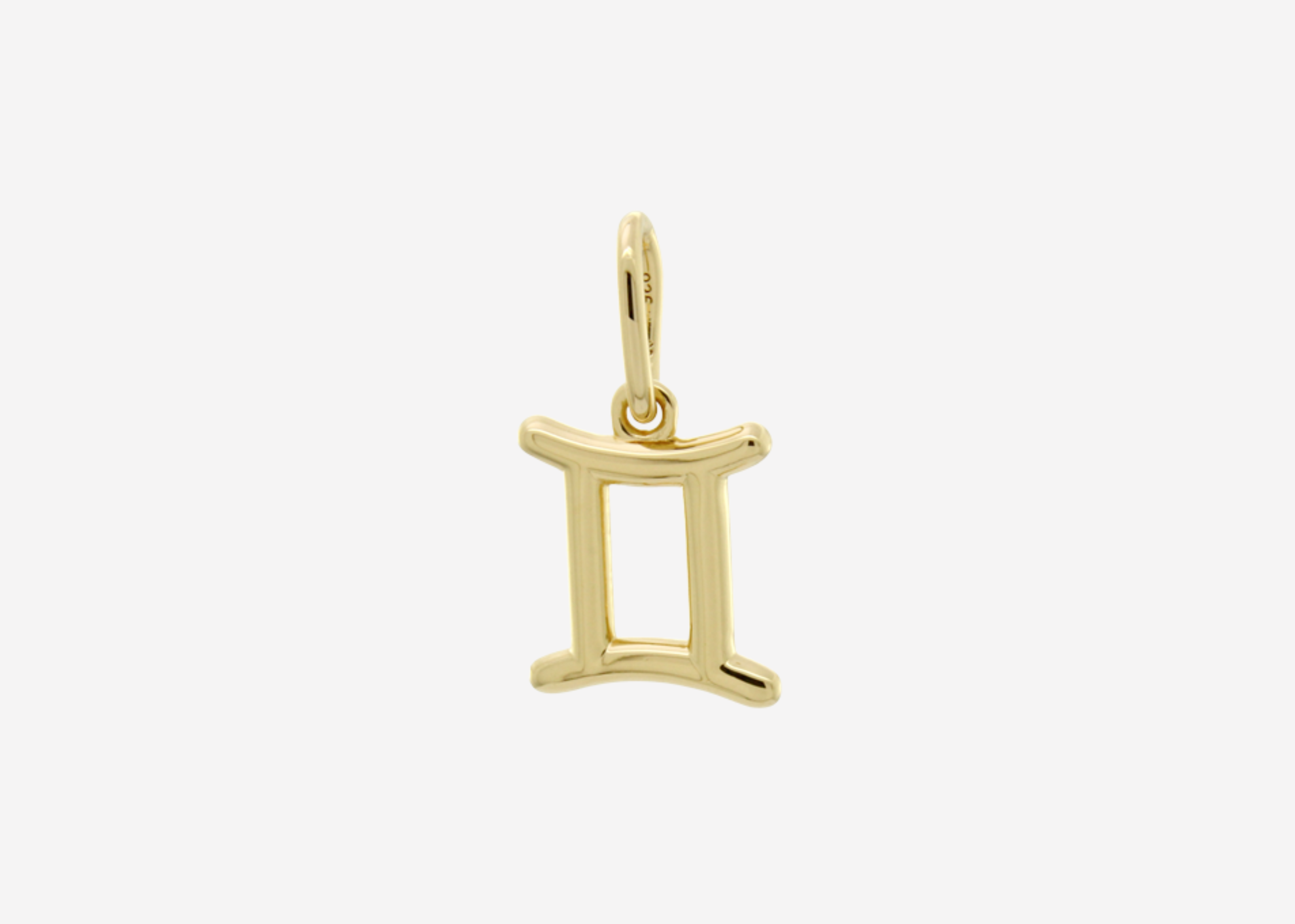 Şener Besim Gemini Charm in 14ct gold plating, flat lay