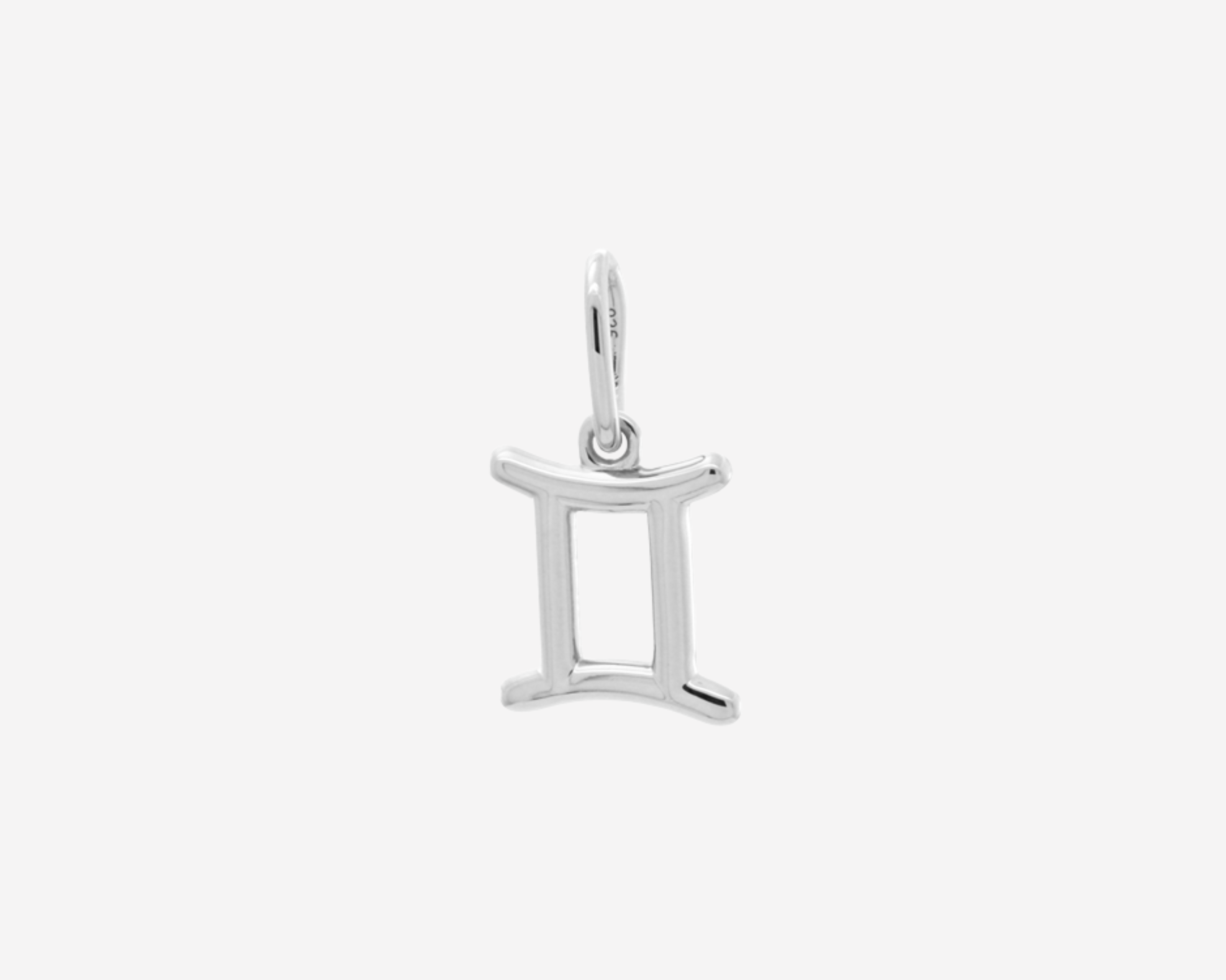 Şener Besim Gemini Charm in silver rhodium plating, flat lay