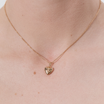 Şener Besim Heart Locket Charm worn as a necklace pendant