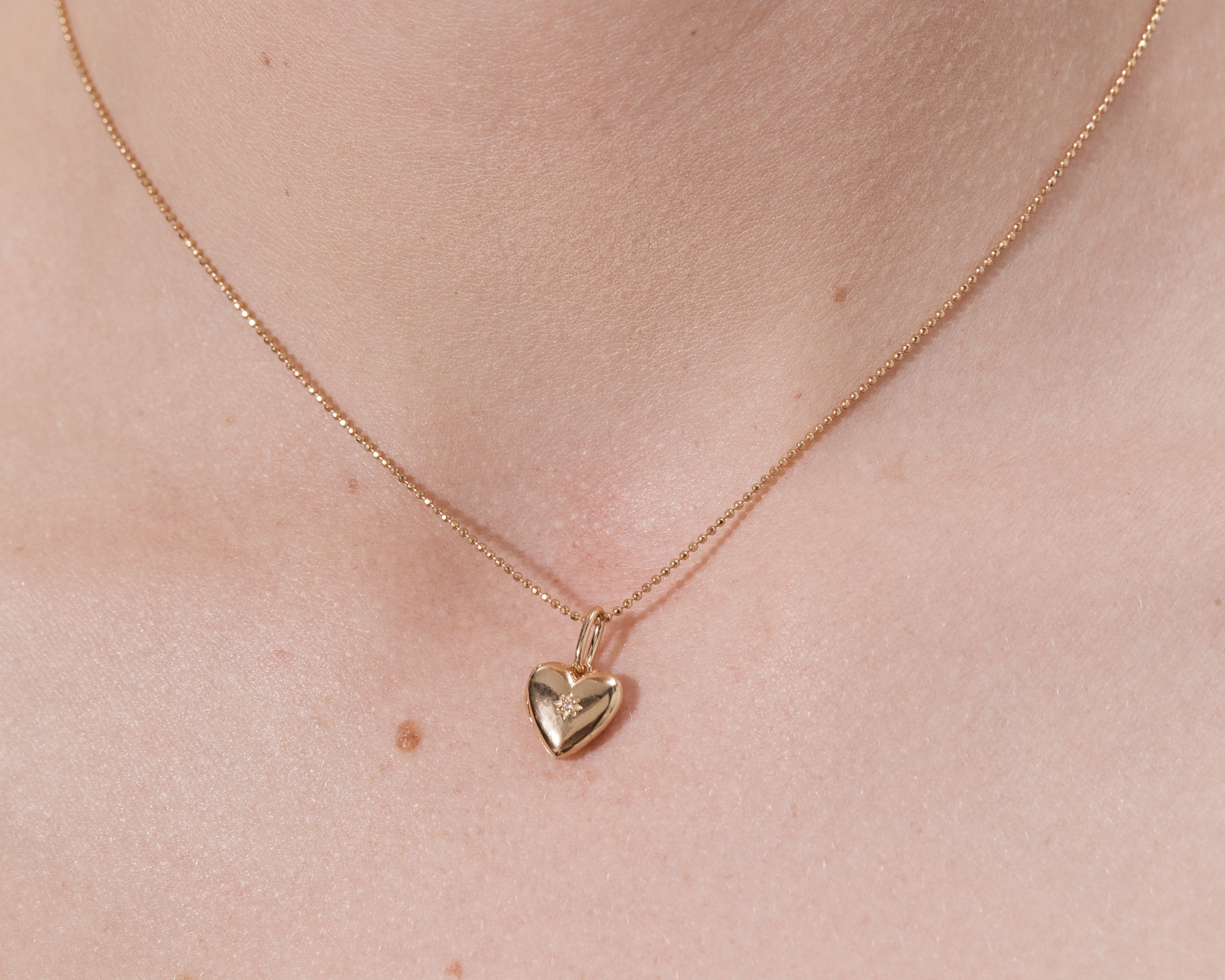 Şener Besim Heart Locket Charm worn as a necklace pendant