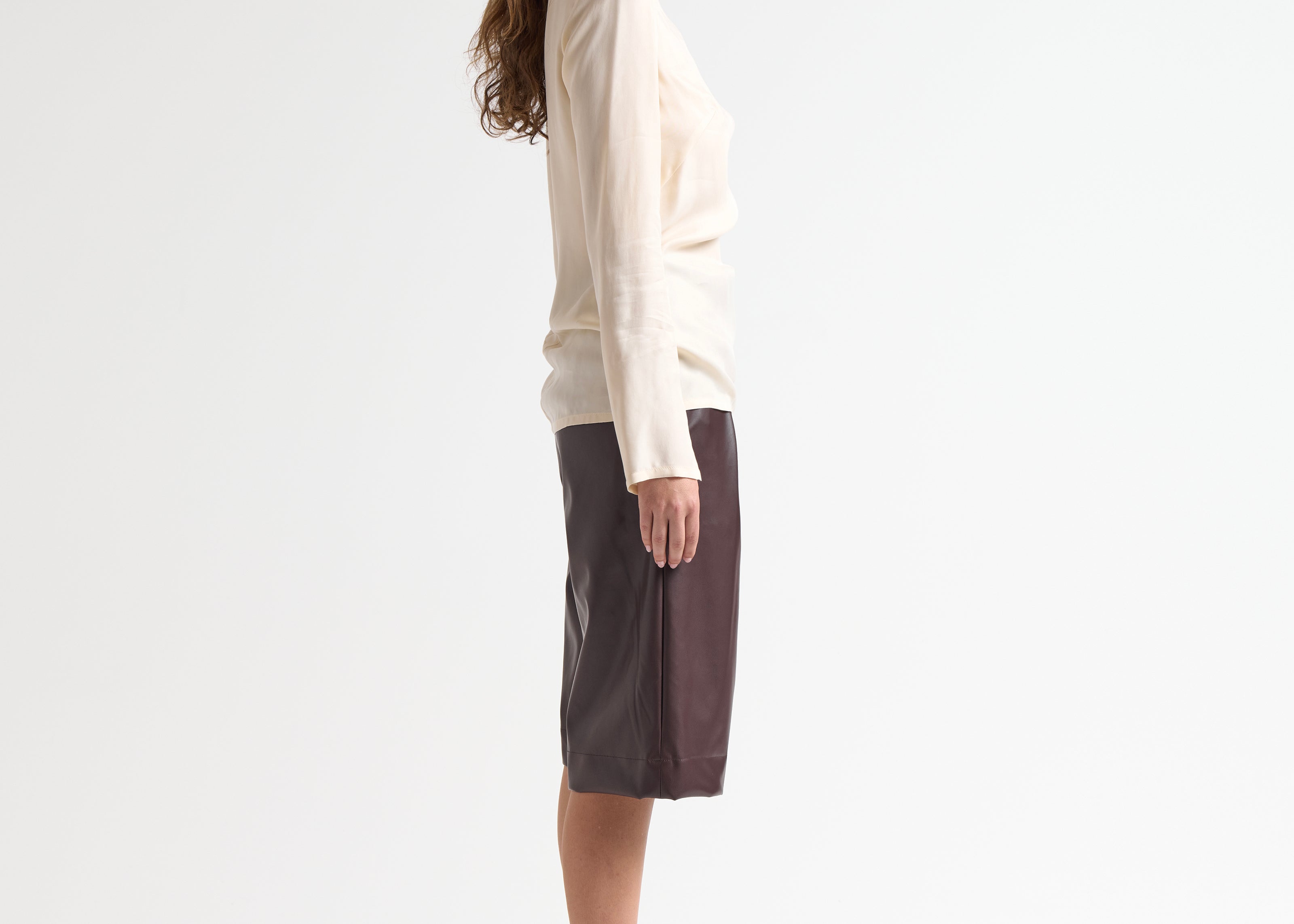 high neck relaxed fit blouse in cream on model by sener besim