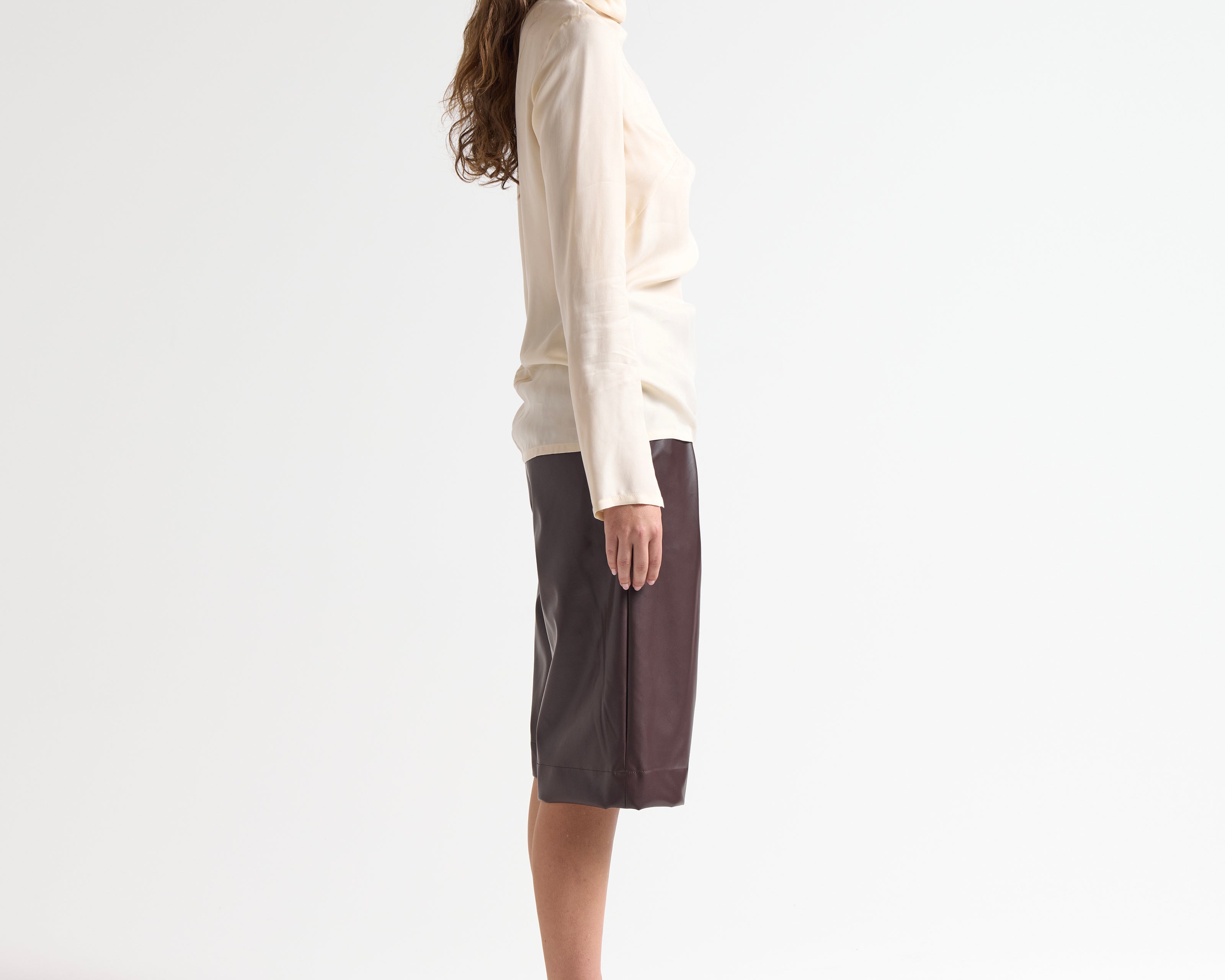 high neck relaxed fit blouse in cream on model by sener besim