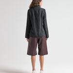model wearing high neck blouse in black by sener besim