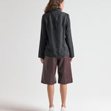 model wearing high neck blouse in black by sener besim